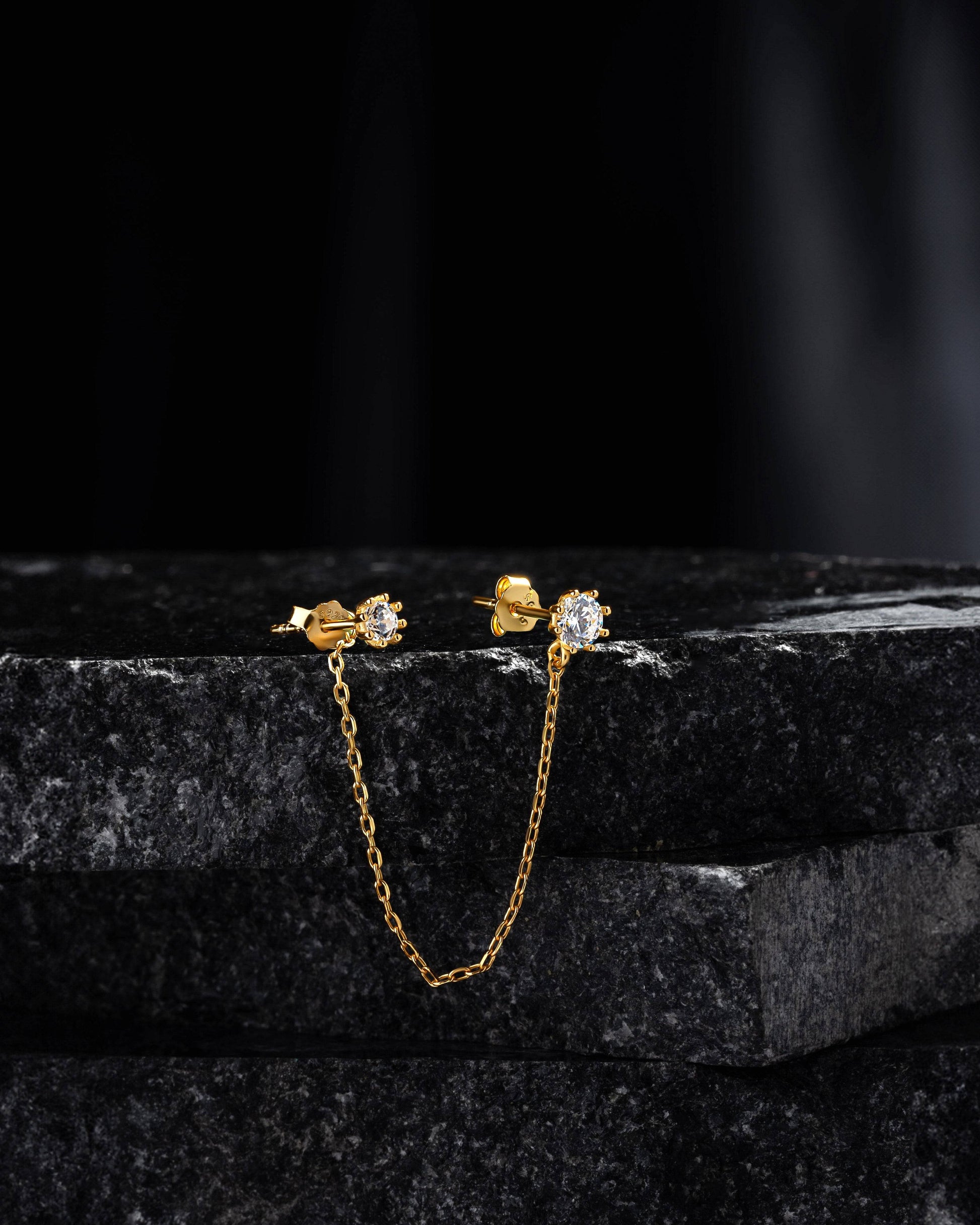 Solitaire Chain Connector - 3-in-1 stud featuring a gold chain linking two solitaire studs, ideal for helix or lobe styling in fine jewelry.