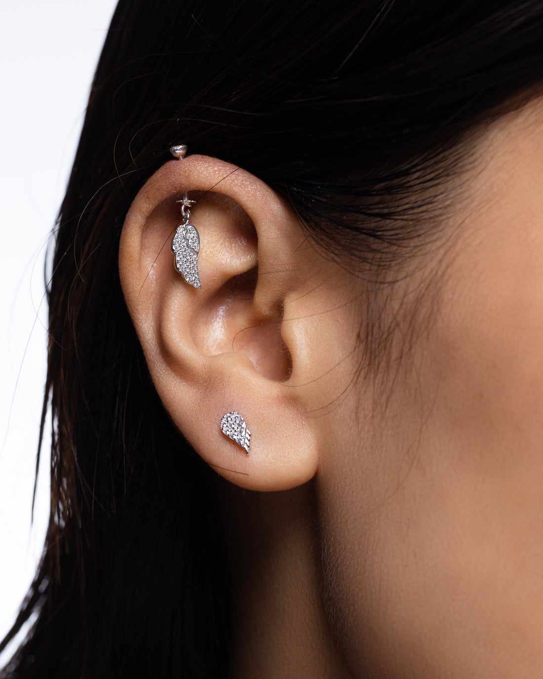 Helix Hanging Fairy Wings earrings in sterling silver with zircon stones, featuring a delicate wing design for a magical piercing style.